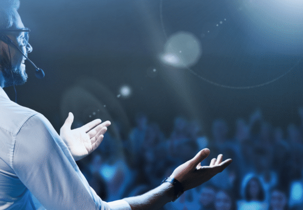 An-event-emcee-in-front-of-an-audience