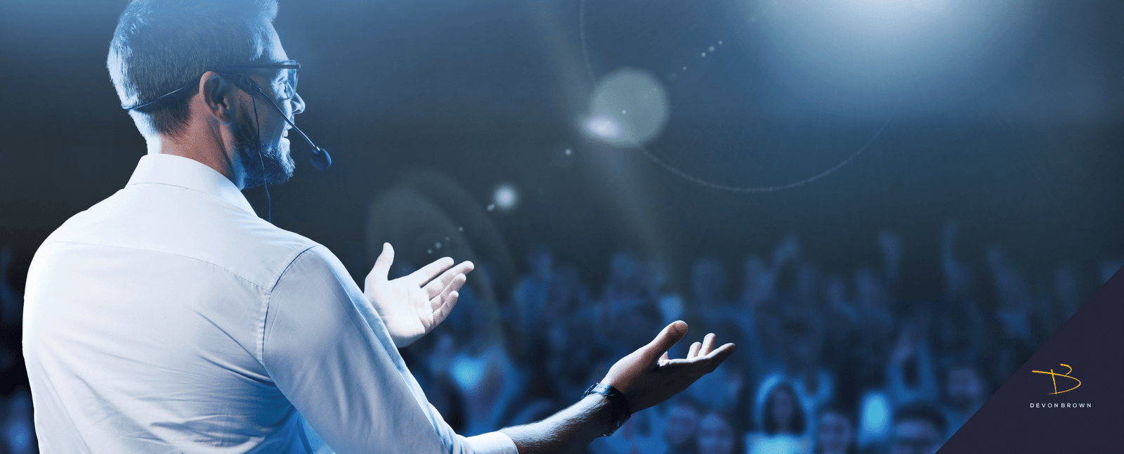 An-event-emcee-in-front-of-an-audience