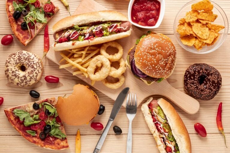 6820617c034820a8b998bb3c_671ead7edc757970e5115697_671eacfbb6f7a79d7ce2adde_top-view-arrangement-with-food-wooden-background_23-2148308806